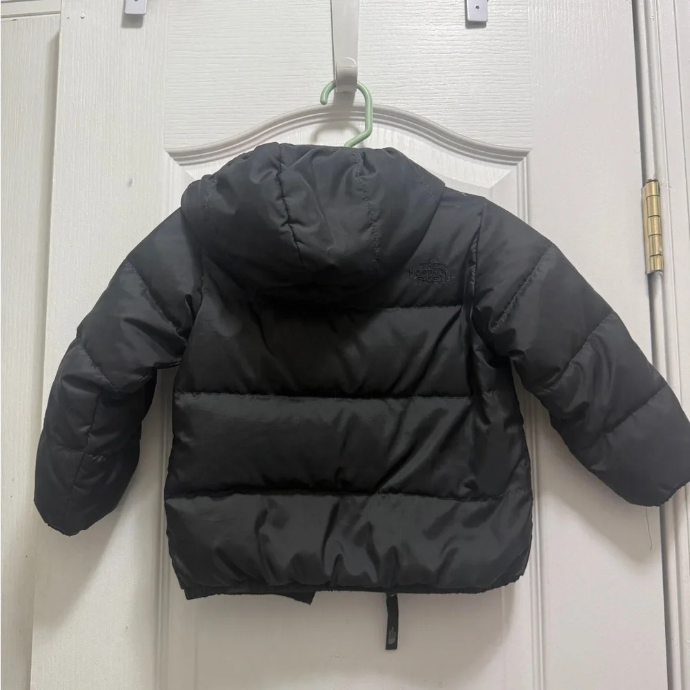 The North Face Kids Black and Red Puffer Jacket. Two-sided black and red